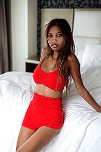 Lexi Chan takes off red dress presenting her big boobs and alluring physique
