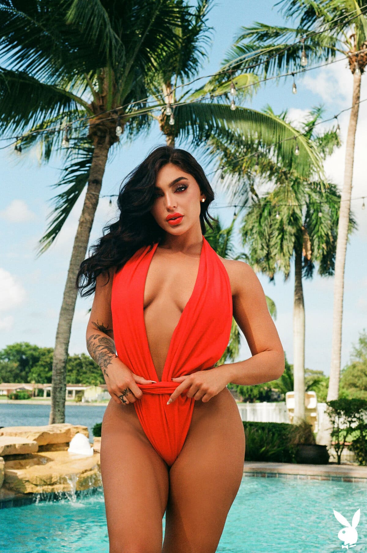 Alluring Emjay Rinaudo poses seductively at the poolside, stripping her red  dress